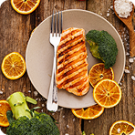 Delicious grilled salmon with broccoli and orange slices